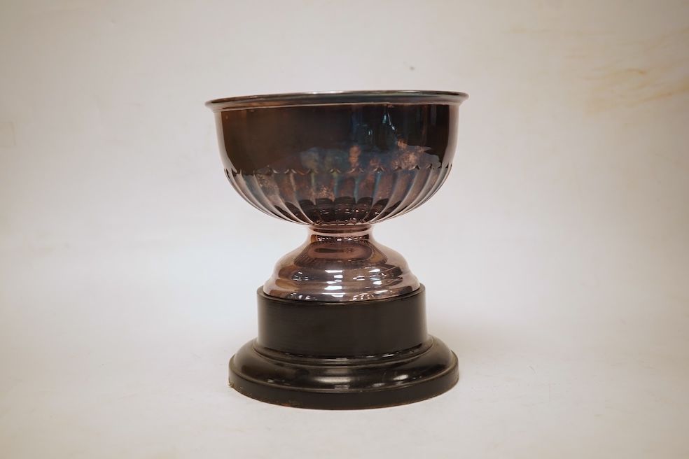 A George VI demi-fluted silver rose bowl, by Walker & Hall, Sheffield, 1939, diameter 14.4cm, 7.2oz, on an ebonised socle.